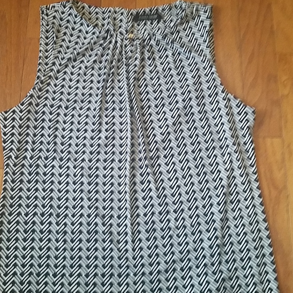 Blue and white sleeveless blouse